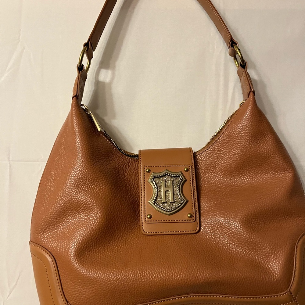 Chic Tan Leather Hobo Bag with Emblem